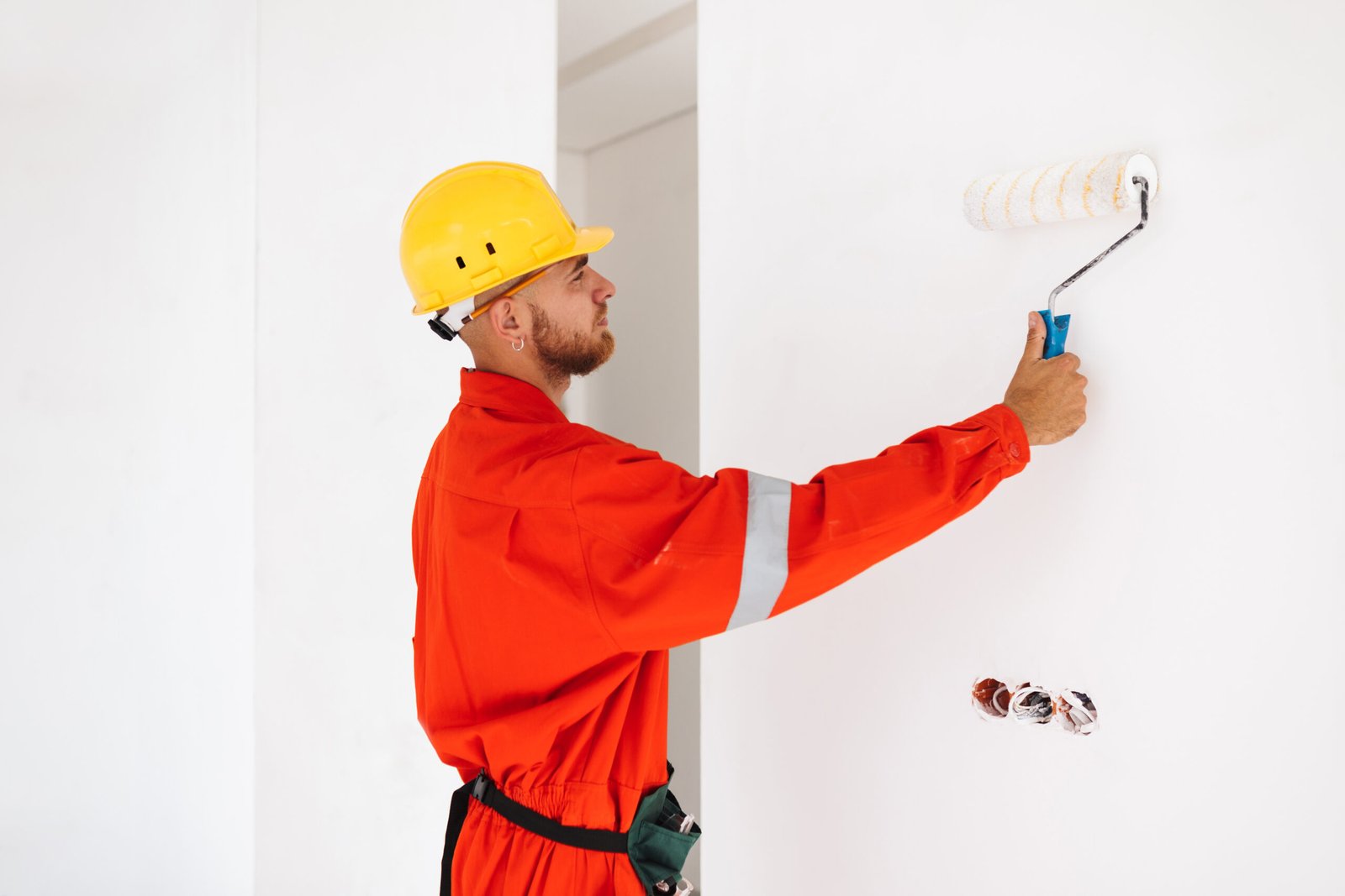 young foreman in orange work clothes and yellow ha 2023 11 27 05 29 07 utc scaled